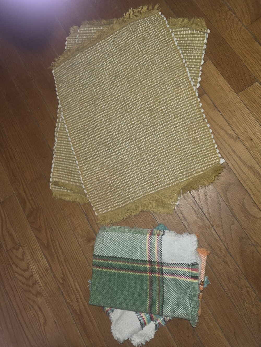 Set Of woven yellow cotton placemats feature a fringed edge + 3 Extra Mats